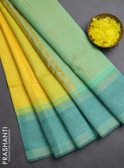 Semi dupion saree yellow and teal green with allover zari weaves and rettapet zari woven border