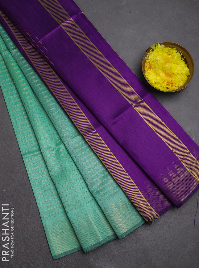 Semi dupion saree teal green and violet with allover zari woven buttas and temple design zari woven border