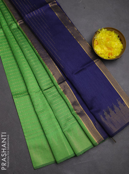 Semi dupion saree green and navy blue with allover zari woven buttas and temple design zari woven border