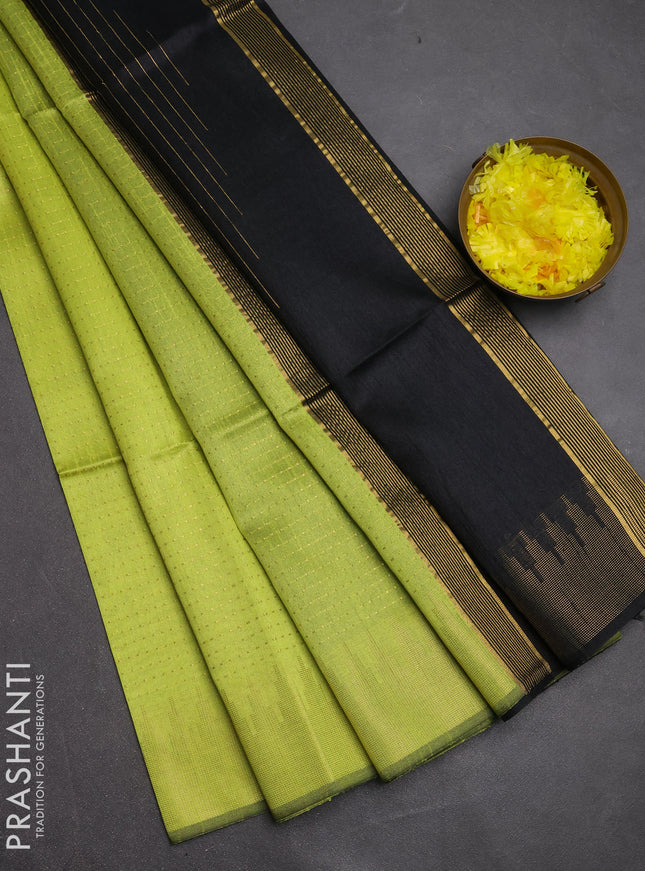 Semi dupion saree fluorescent green and black with allover zari woven buttas and temple design zari woven border