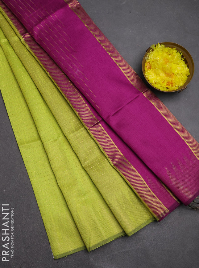 Semi dupion saree fluorescent green and purple with allover zari woven buttas and temple design zari woven border