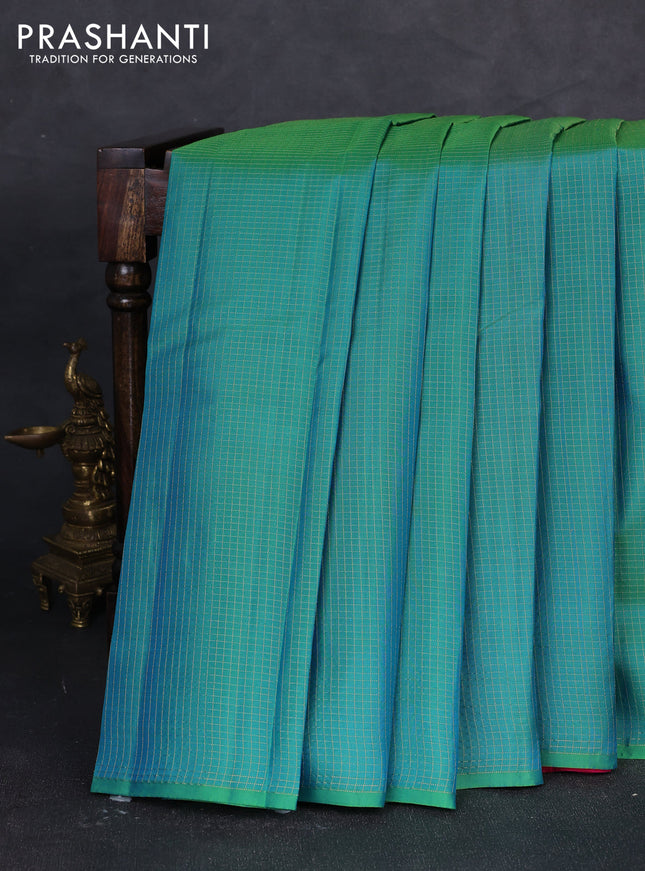 Pure kanchipuram silk saree dual shade of teal green and pink with allover zari small checked pattern in borderless style