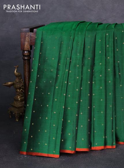 Pure kanchipuram silk saree green and rustic orange with allover zari woven buttas and piping border