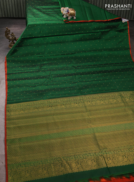 Pure kanchipuram silk saree green and rustic orange with allover zari woven buttas and piping border