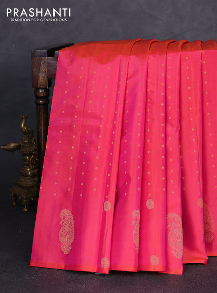 Pure kanchipuram silk saree dual shade of pinkish orange with allover zari woven buttas in borderless style