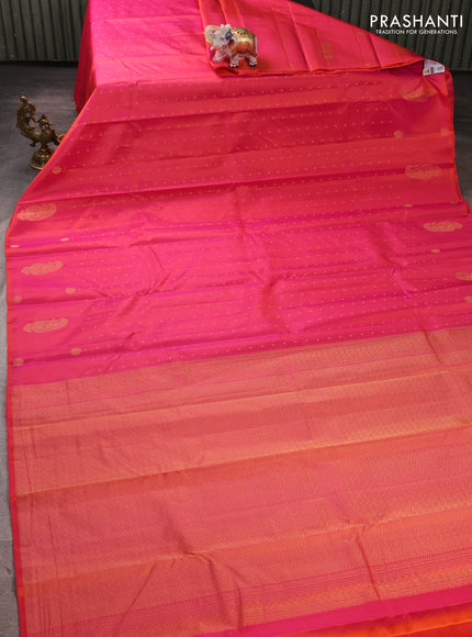 Pure kanchipuram silk saree dual shade of pinkish orange with allover zari woven buttas in borderless style