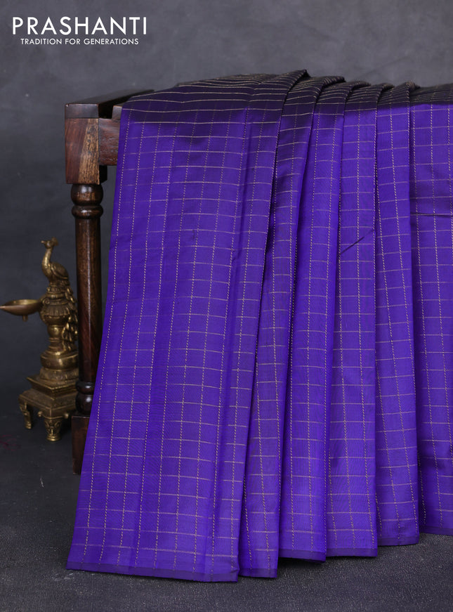 Pure kanchipuram silk saree blue and peach pink with allover zari checked pattern in borderless style
