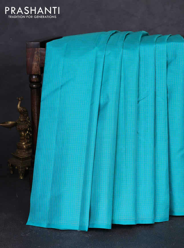 Pure kanchipuram silk saree teal blue and pink with allover zari checked pattern in borderless style
