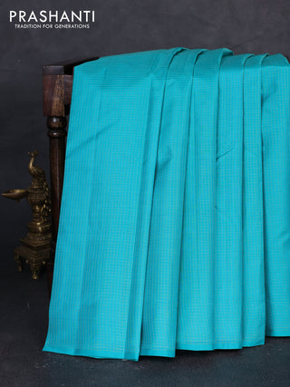 Pure kanchipuram silk saree teal blue and pink with allover zari checked pattern in borderless style