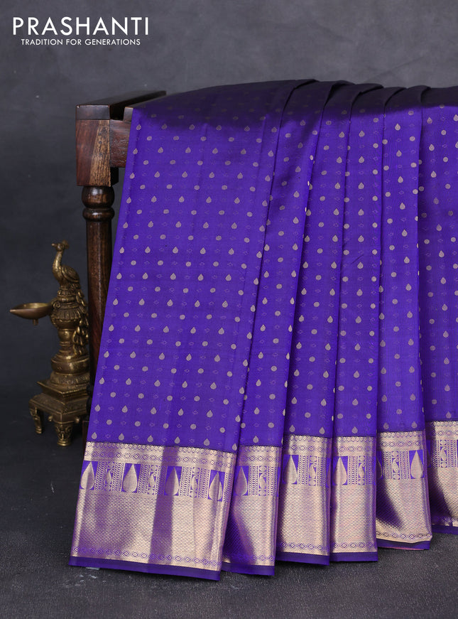 Pure kanchipuram silk saree blue and mauve pink with allover zari woven buttas and zari woven korvai border