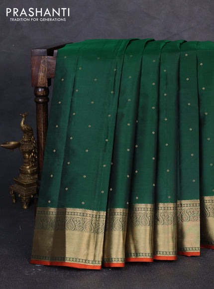 Pure kanchipuram silk saree green and rust shade with allover zari woven buttas and zari woven korvai border