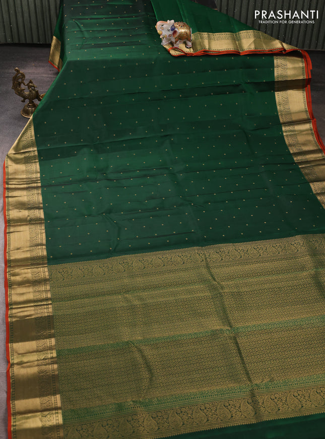 Pure kanchipuram silk saree green and rust shade with allover zari woven buttas and zari woven korvai border