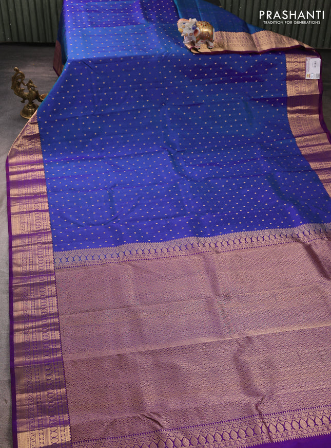 Pure kanchipuram silk saree blue and purple with allover zari woven buttas and zari woven korvai border