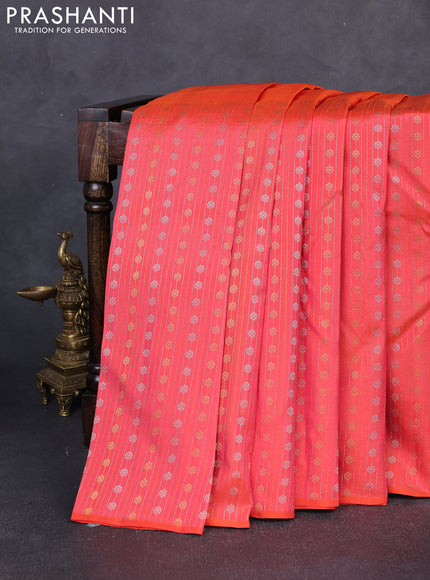 Pure kanchipuram silk saree orange with plain body and long silver & zari woven border