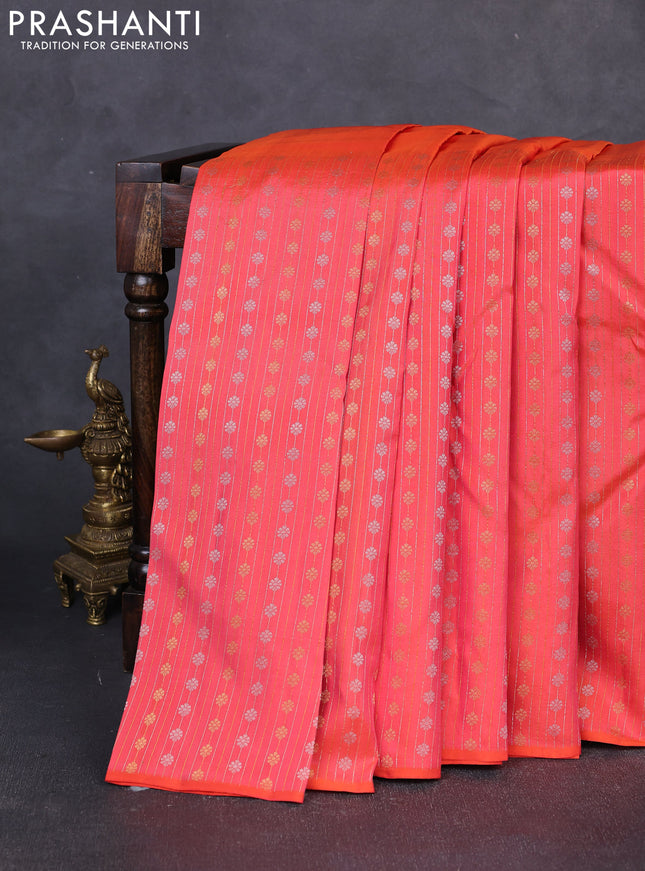 Pure kanchipuram silk saree orange with plain body and long silver & zari woven border