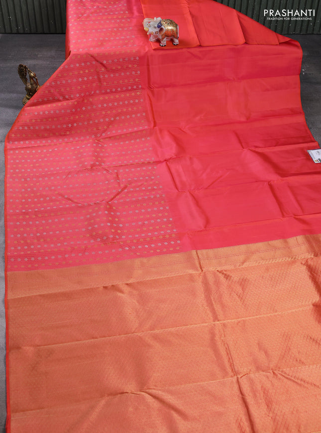 Pure kanchipuram silk saree orange with plain body and long silver & zari woven border