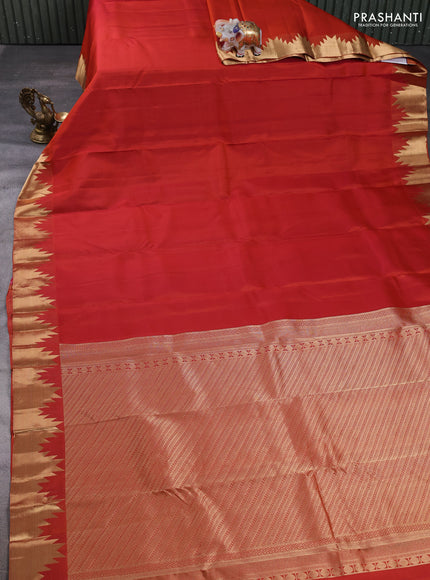Pure kanchipuram silk saree rust shade with plain body and temple zari woven border