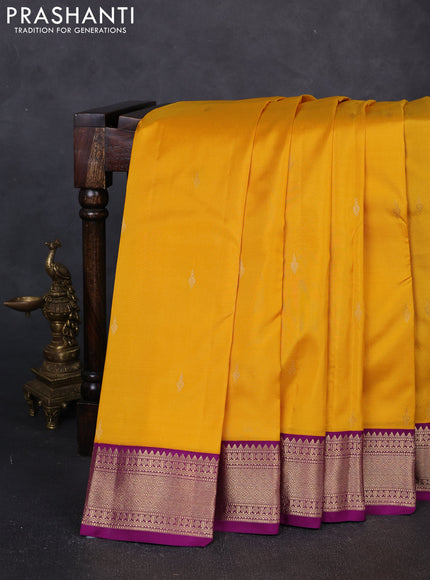 Pure kanchipuram silk saree yellow and purple with zari woven buttas and zari woven korvai border