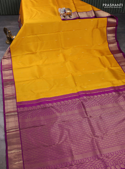 Pure kanchipuram silk saree yellow and purple with zari woven buttas and zari woven korvai border