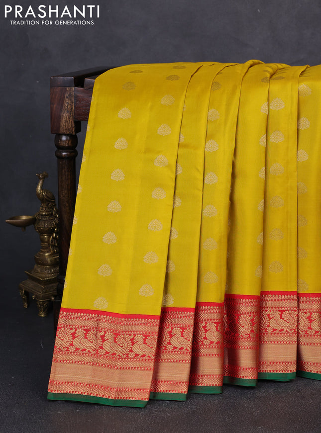 Pure kanchipuram silk saree mustard yellow and red with allover zari woven buttas and zari woven korvai border