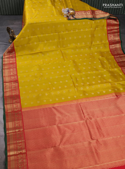Pure kanchipuram silk saree mustard yellow and red with allover zari woven buttas and zari woven korvai border