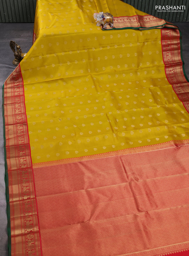 Pure kanchipuram silk saree mustard yellow and red with allover zari woven buttas and zari woven korvai border