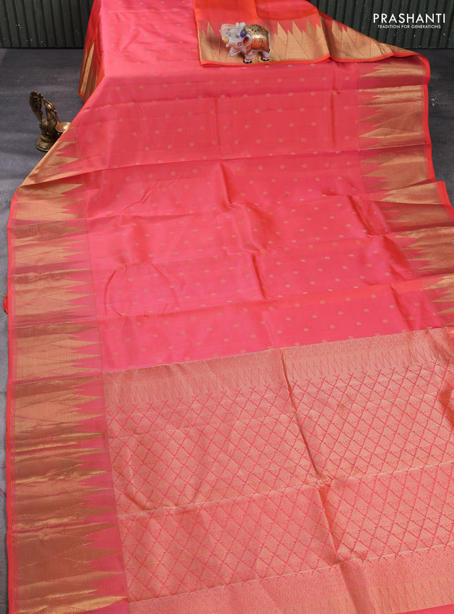 Pure kanchipuram silk saree orange with allover zari woven buttas and temple zari woven border
