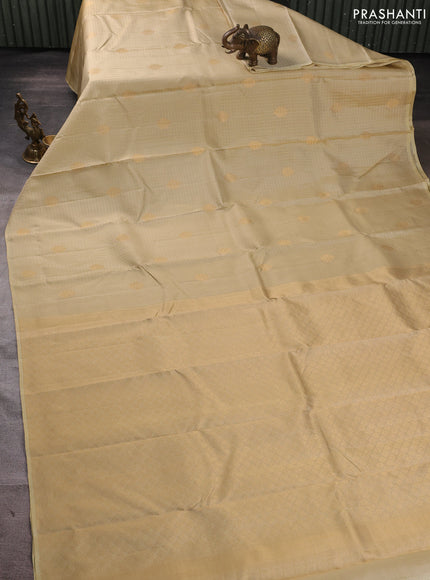 Pure kanchipuram silk saree beige with allover small zari checks & buttas in borderless style