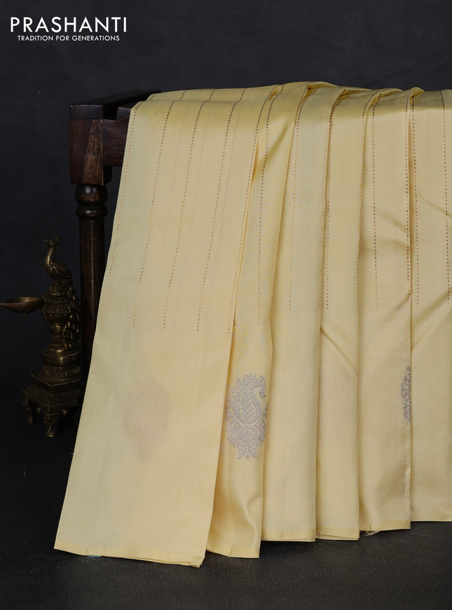 Pure kanchipuram silk saree cream and wine shade with allover zari weaves and silver & gold zari woven butta border