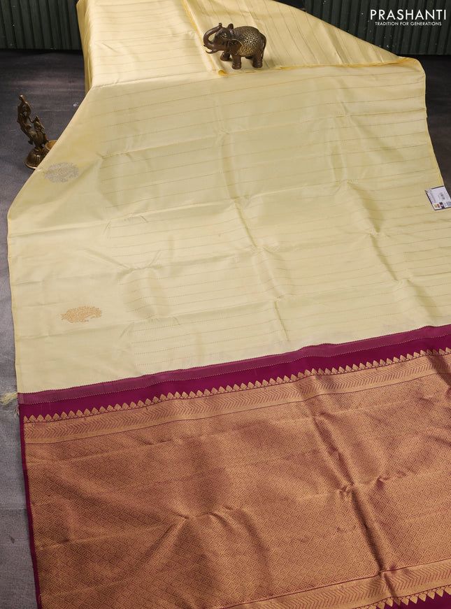 Pure kanchipuram silk saree cream and wine shade with allover zari weaves and silver & gold zari woven butta border