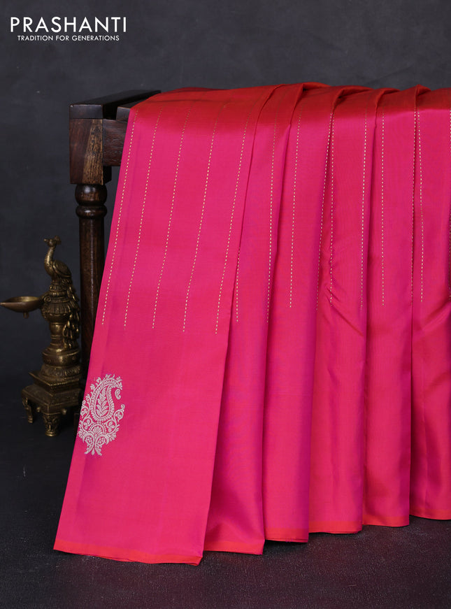 Pure kanchipuram silk saree dual shade of pinkish orange and green with allover zari weaves and silver & gold zari woven butta border