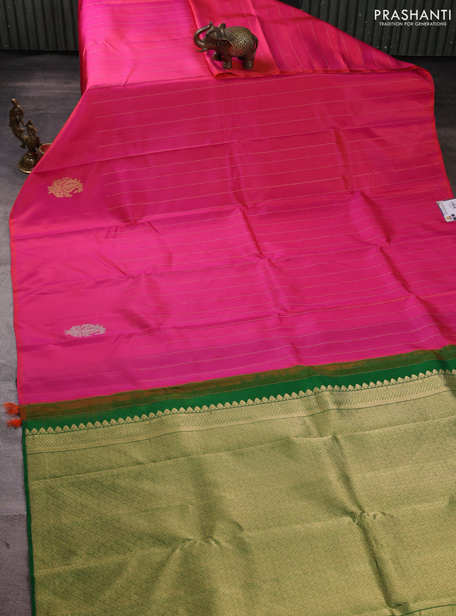 Pure kanchipuram silk saree dual shade of pinkish orange and green with allover zari weaves and silver & gold zari woven butta border