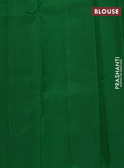 Pure kanchipuram silk saree dual shade of pinkish orange and green with allover zari weaves and silver & gold zari woven butta border