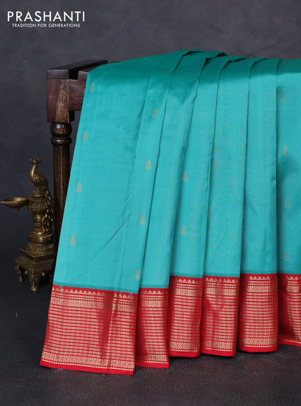Pure kanchipuram silk saree teal green shade and red with zari woven buttas and zari woven korvai border