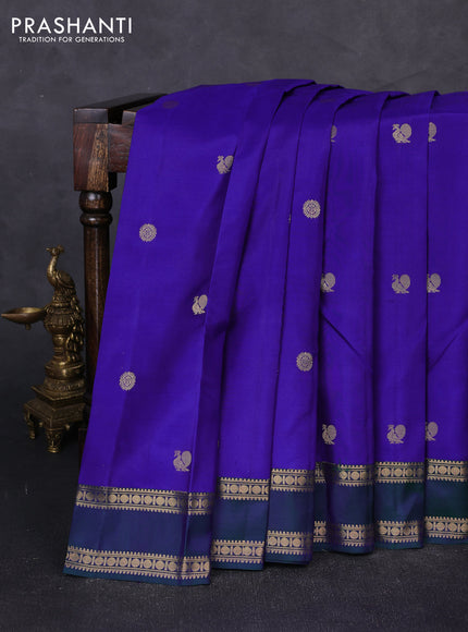 Pure kanchipuram silk saree blue and dual shade of green with zari woven annam & rudhraksha buttas and rettapet zari woven border
