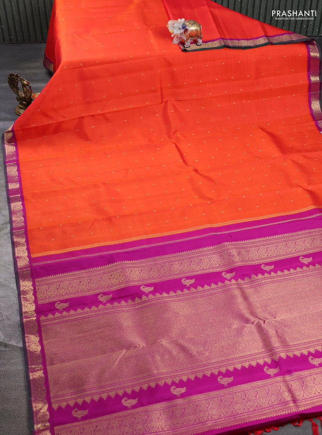 Pure kanchipuram silk saree orange and purple with zari woven buttas and paisley zari woven korvai border