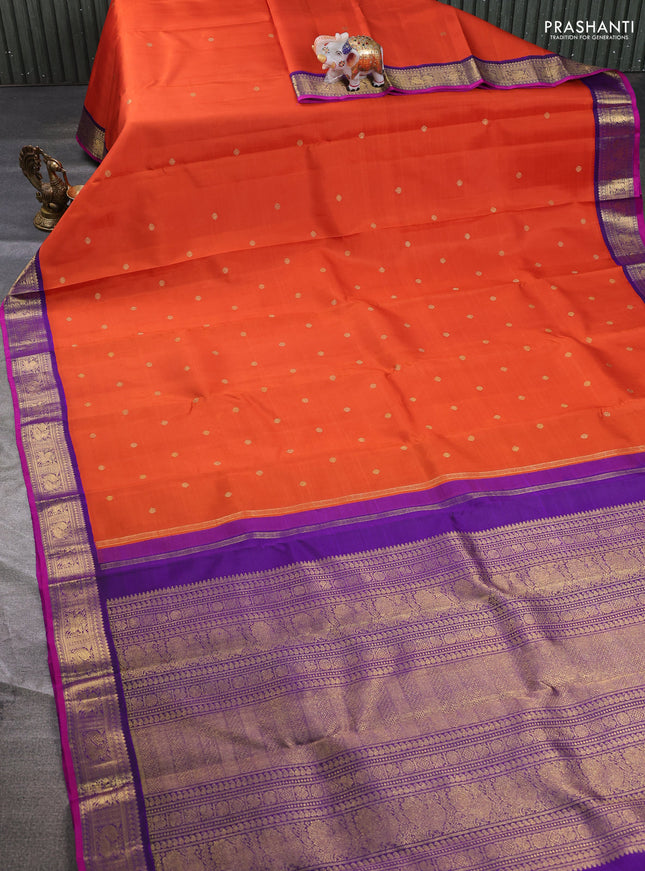 Pure kanchipuram silk saree orange and purple with zari woven buttas and zari woven korvai border