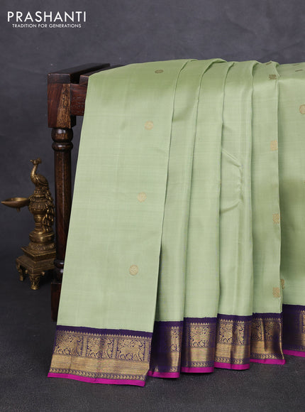 Pure kanchipuram silk saree pista green and dark blue with annam & rudhraksha zari woven buttas and zari woven korvai border