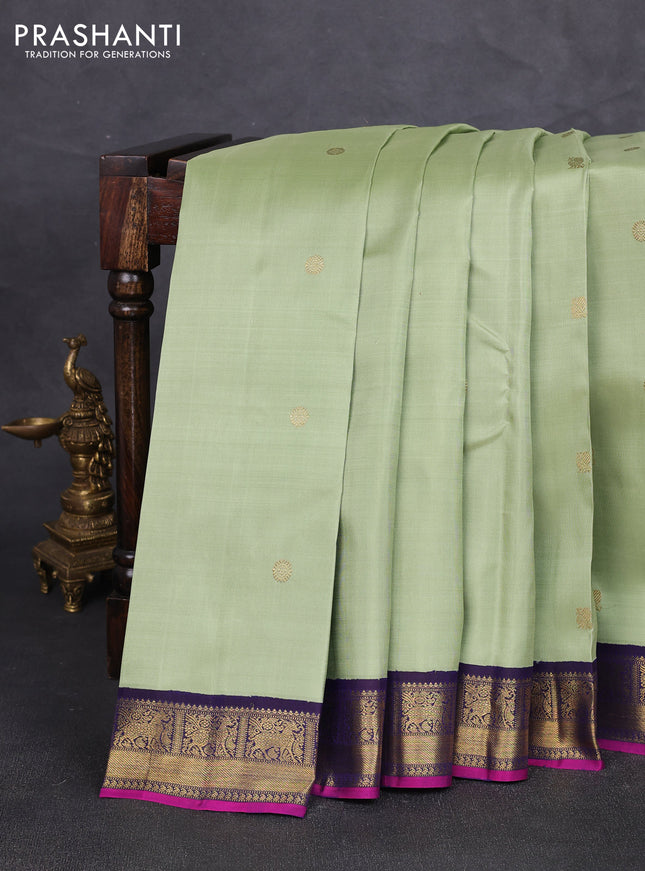 Pure kanchipuram silk saree pista green and dark blue with annam & rudhraksha zari woven buttas and zari woven korvai border