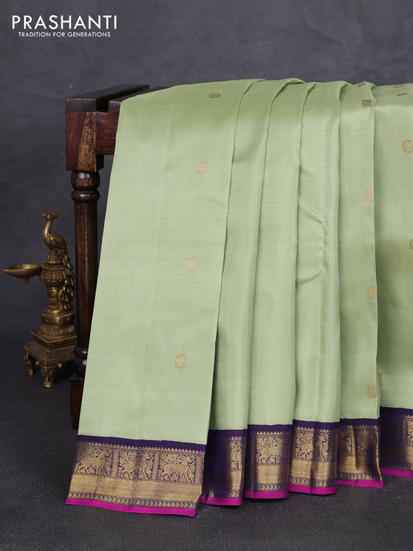 Pure kanchipuram silk saree pista green and dark blue with annam & rudhraksha zari woven buttas and zari woven korvai border