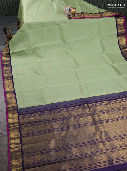 Pure kanchipuram silk saree pista green and dark blue with annam & rudhraksha zari woven buttas and zari woven korvai border