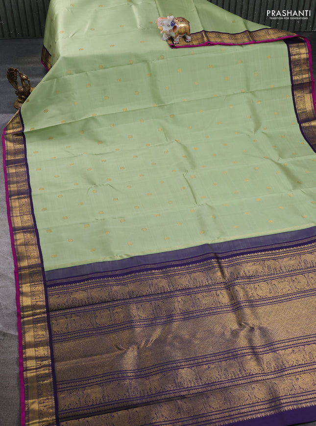 Pure kanchipuram silk saree pista green and dark blue with annam & rudhraksha zari woven buttas and zari woven korvai border