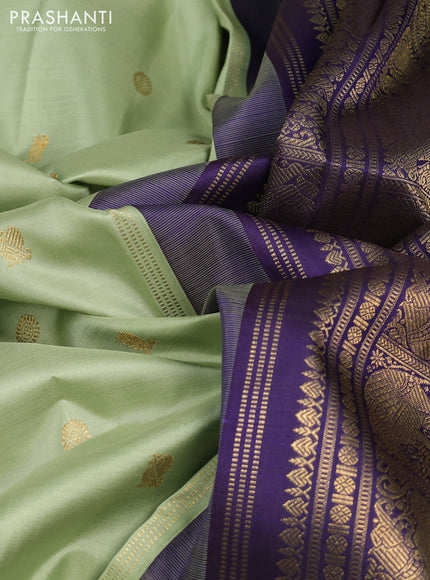 Pure kanchipuram silk saree pista green and dark blue with annam & rudhraksha zari woven buttas and zari woven korvai border