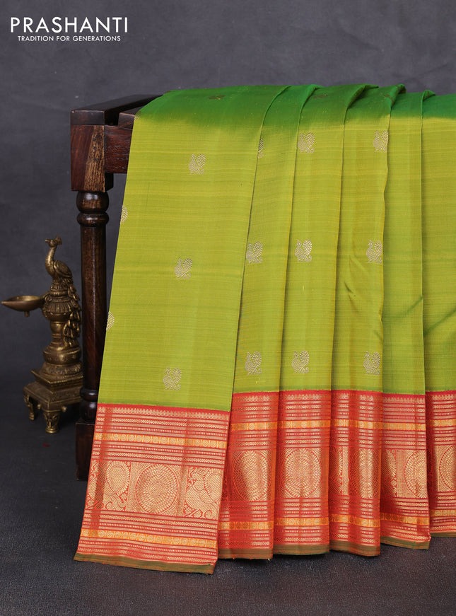 Pure kanchipuram silk saree light green and orange with annam & rudhraksha zari woven buttas and long zari woven korvai border