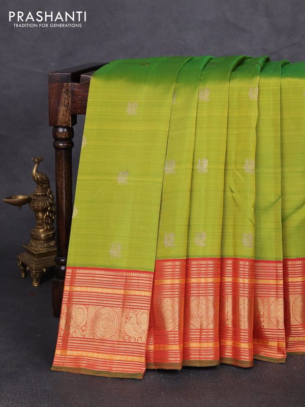 Pure kanchipuram silk saree light green and orange with annam & rudhraksha zari woven buttas and long zari woven korvai border