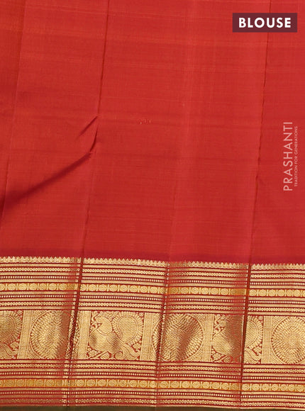 Pure kanchipuram silk saree light green and orange with annam & rudhraksha zari woven buttas and long zari woven korvai border