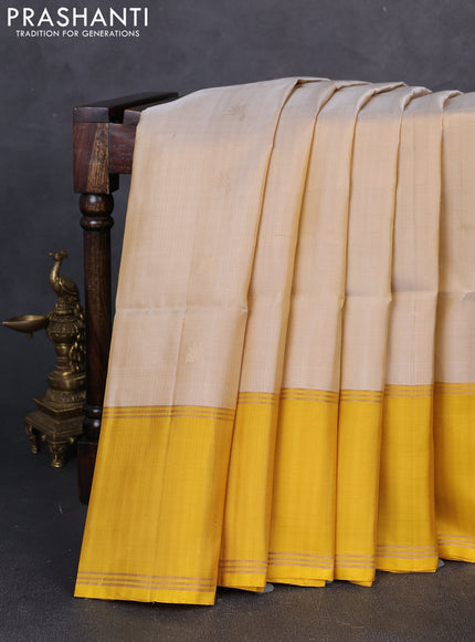 Pure soft silk saree beige and yellow with zari woven buttas and rettapet zari woven border