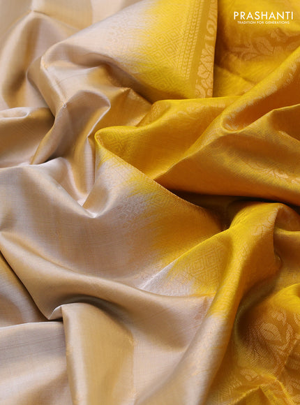 Pure soft silk saree beige and yellow with allover zari woven buttas and rettapet zari woven border