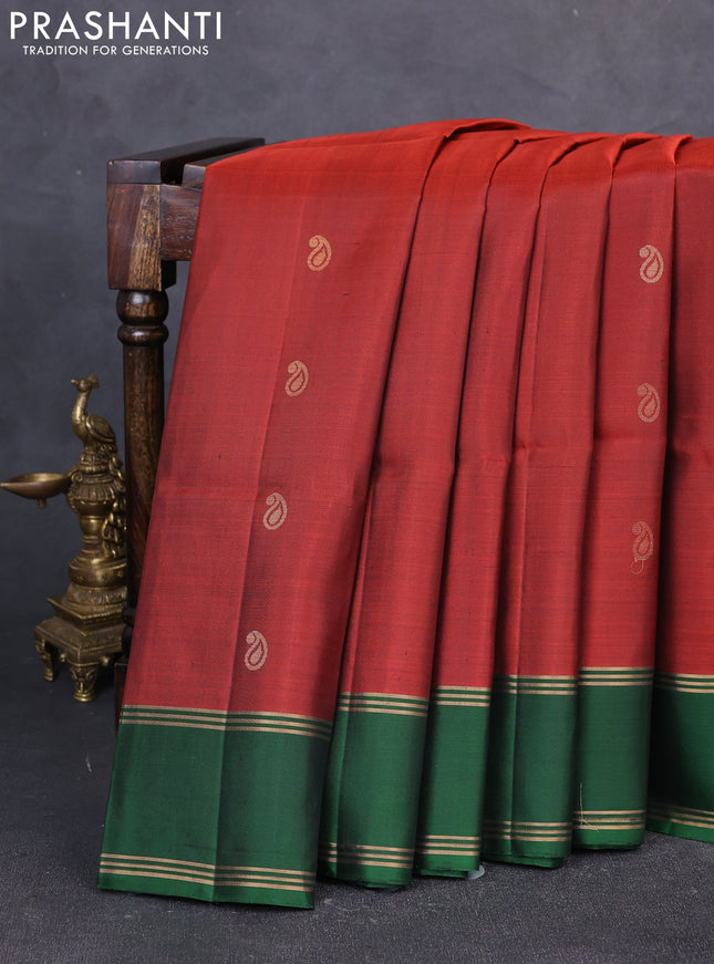 Pure soft silk saree rustic orange and green with allover zari woven buttas and rettapet zari woven border