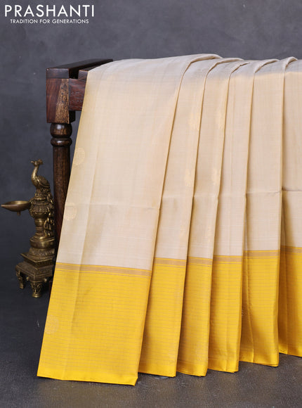 Pure soft silk saree beige and yellow with zari woven buttas and zari woven butta border